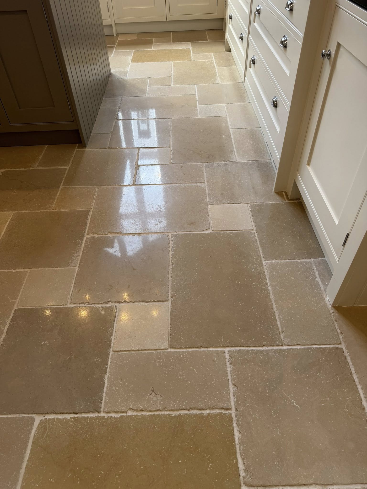 Limestone kitchen floor cleaned and restored by Floorless Restoration